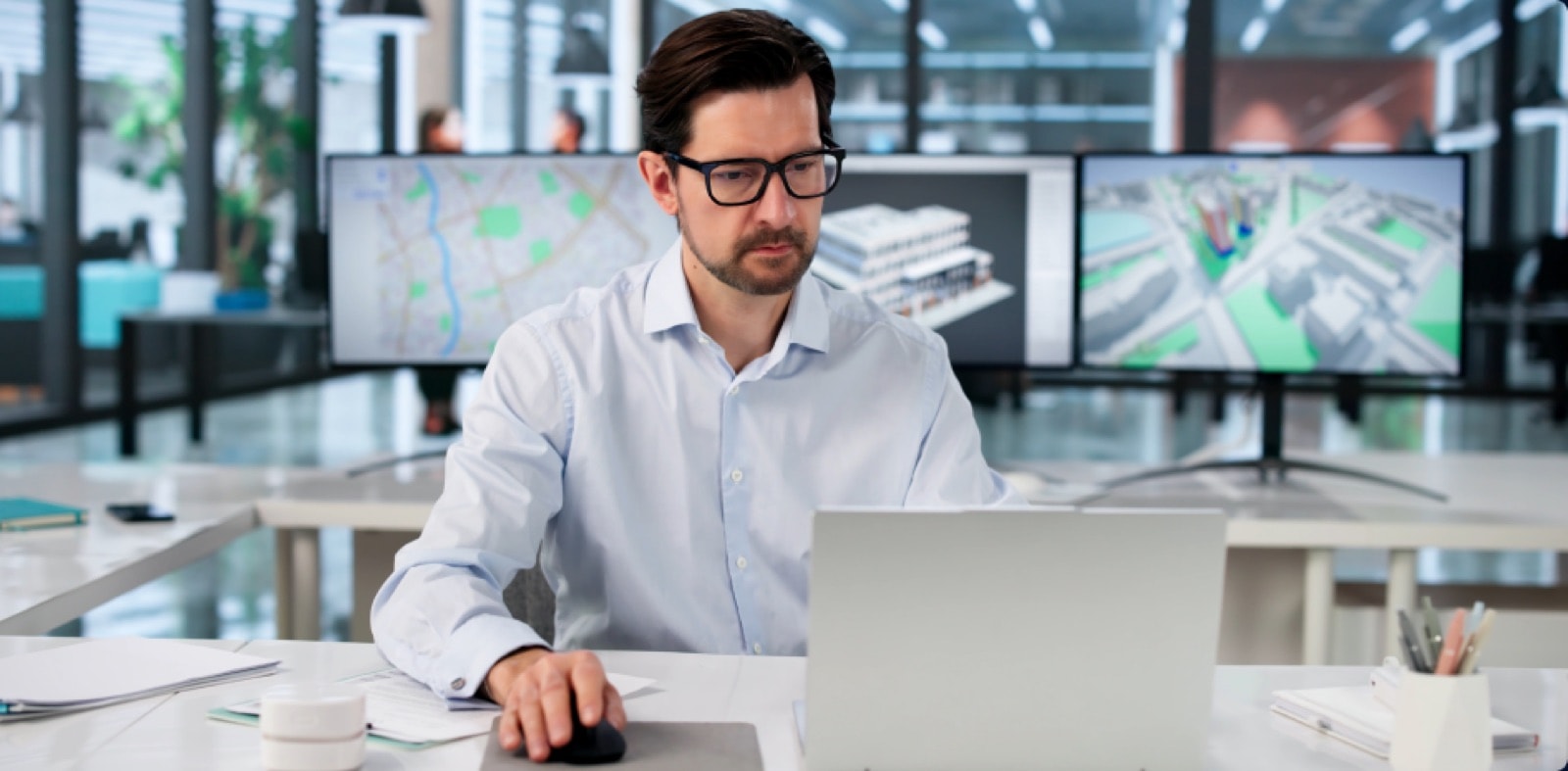 Professional working at a wall of monitors