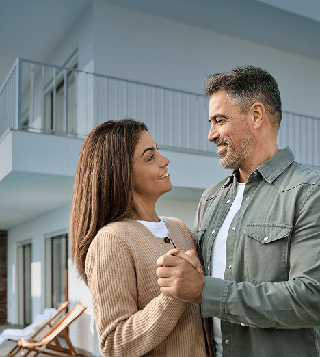 Couple at their new home